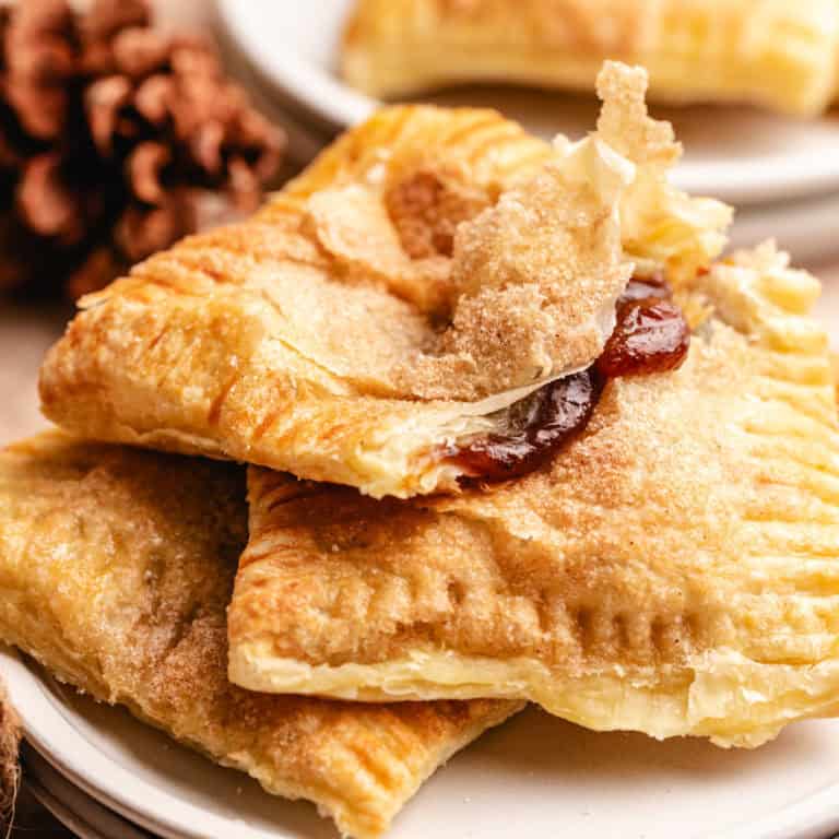 Pumpkin butter hand pies with a flaky puff pastry crust, showcasing the best hand pies recipe for fall foods and thanksgiving desserts.