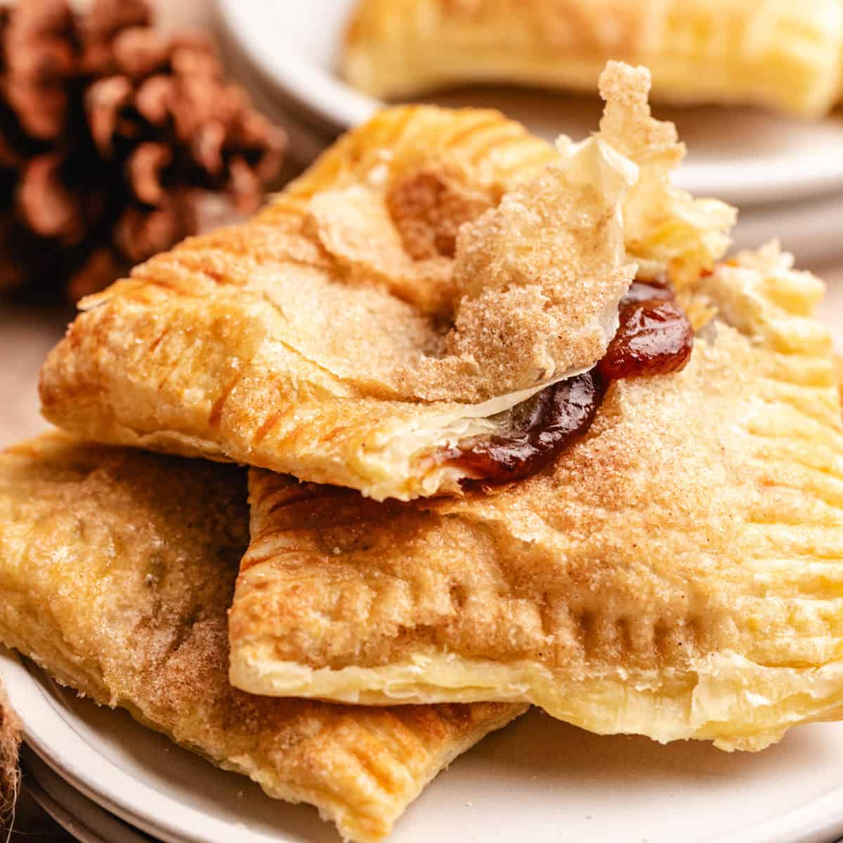 Pumpkin butter hand pies with a flaky puff pastry crust, showcasing the best hand pies recipe for fall foods and thanksgiving desserts.