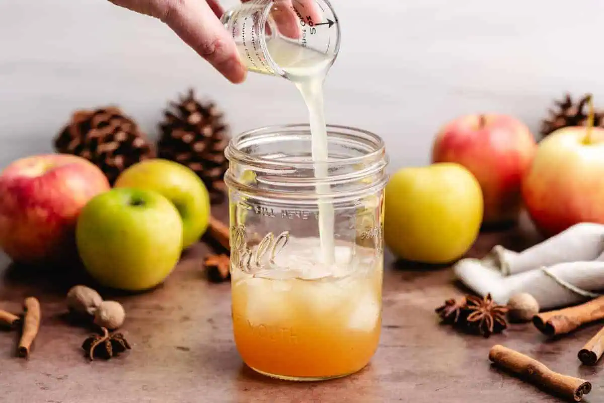 Lime juice being poured into a jar.