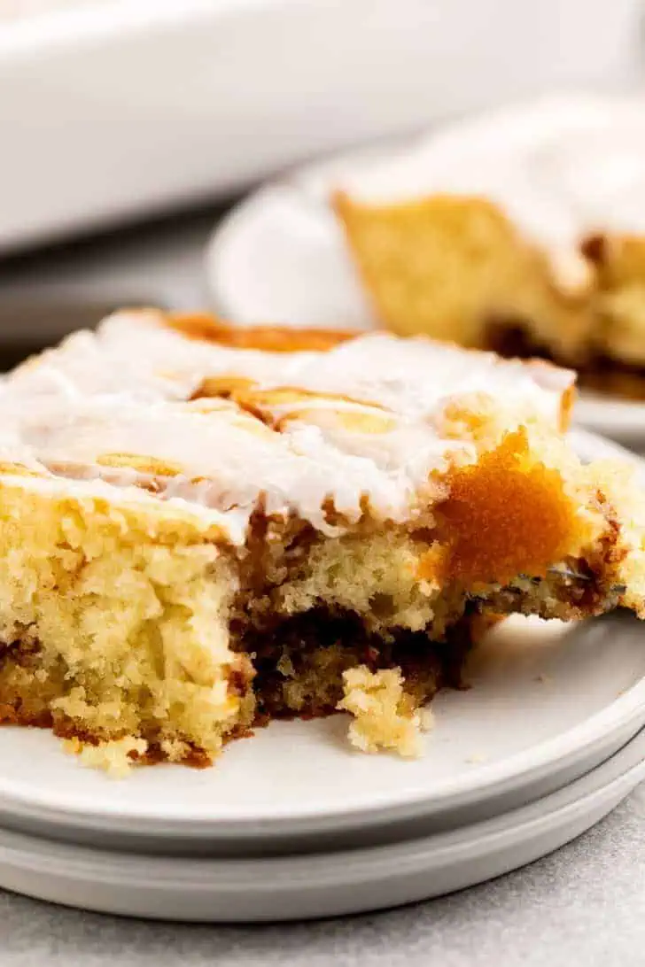 Bite of cinnamon roll cake on a fork.