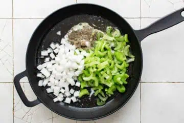 Butter, onion, celery, sage, thyme, salt, and pepper in a pan.