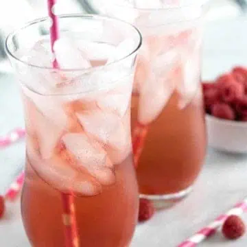 Raspberry italian soda in two tall glasses.