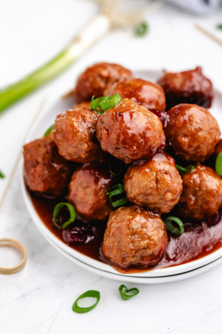 Overhead view of cranberry meatballs with bbq sauce.