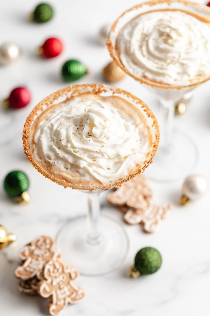 Overhead shot of gingerbread martinis and festive decorations.