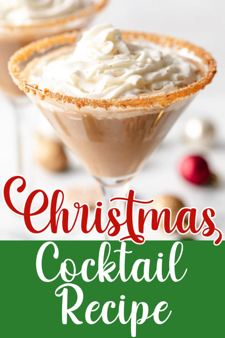 Close-up of whipped cream-topped gingerbread martini with decorative cookie rim.