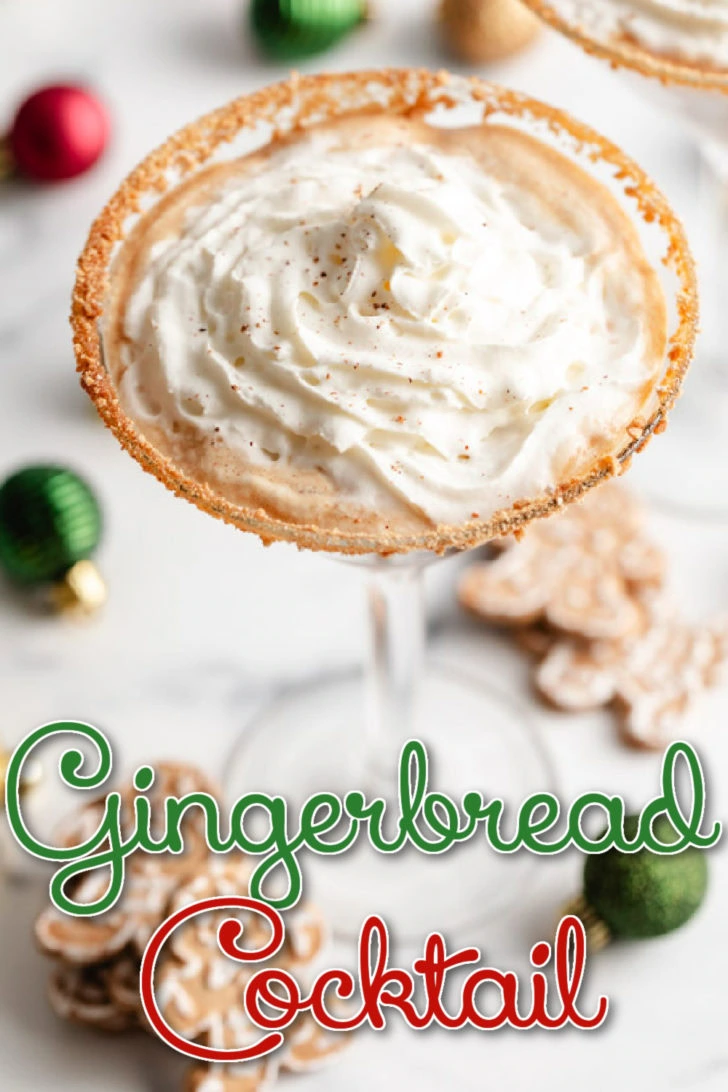 Overhead view of a gingerbread martini surrounded by holiday cookies and ornaments.