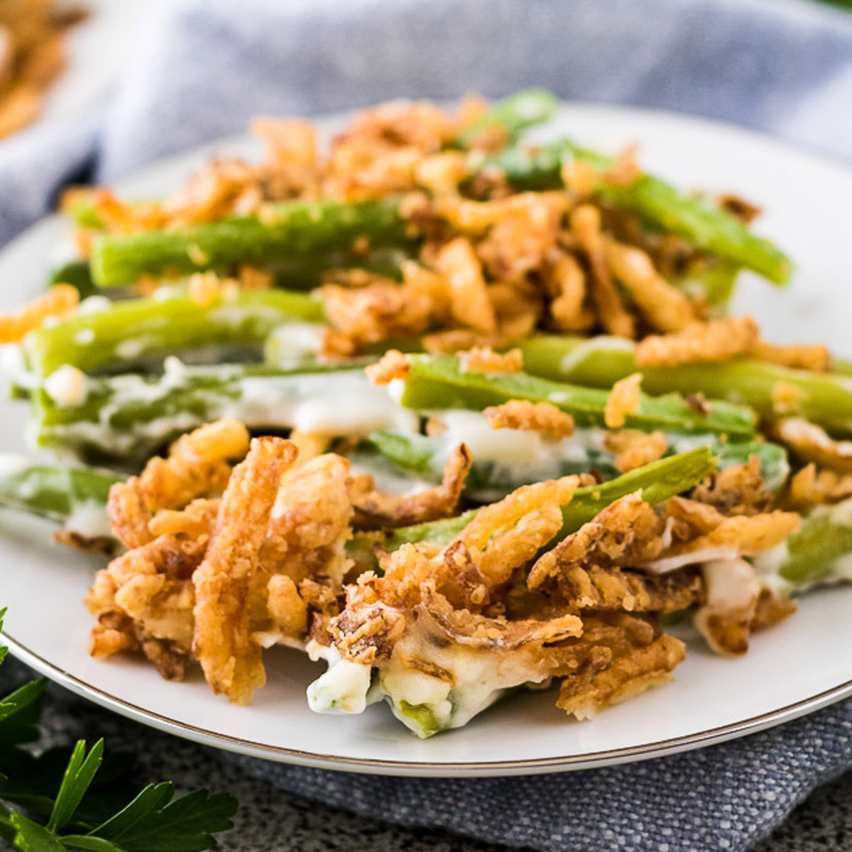 Green bean casserole on a white plate.