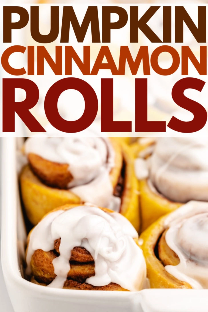 Close up view of cinnamon rolls in a white pan.