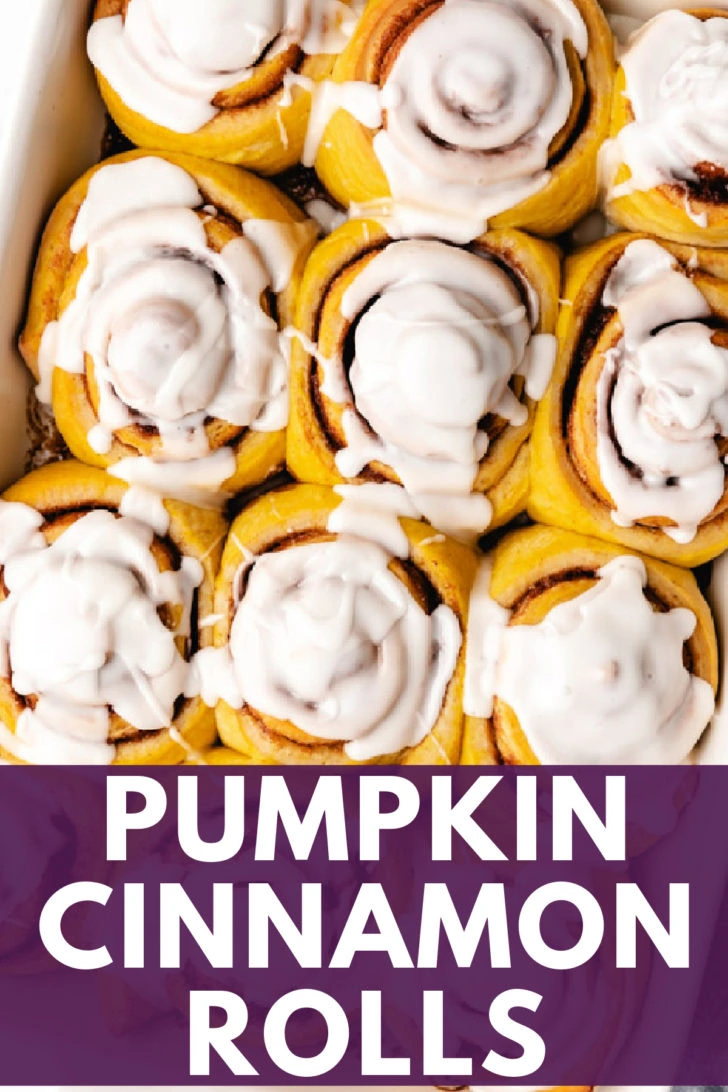 Overhead view of pumpkin cinnamon rolls in a pan.