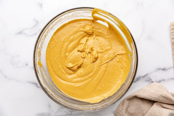 Pumpkin pie dip in a glass mixing bowl.