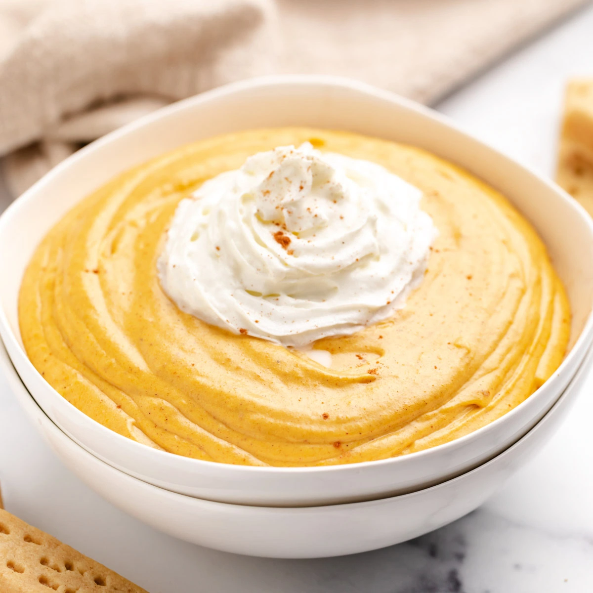 Close up view of pumpkin dip in a bowl.