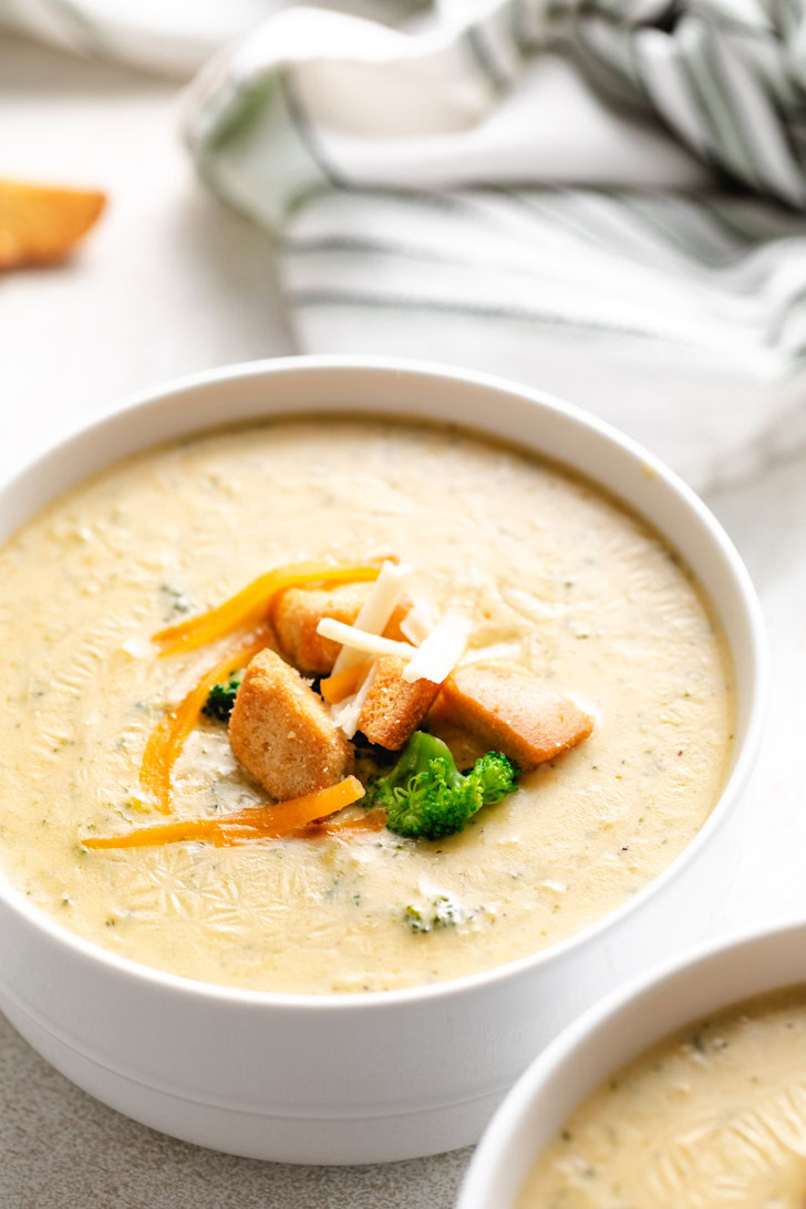 Broccoli soup topped with cheese and croutons.