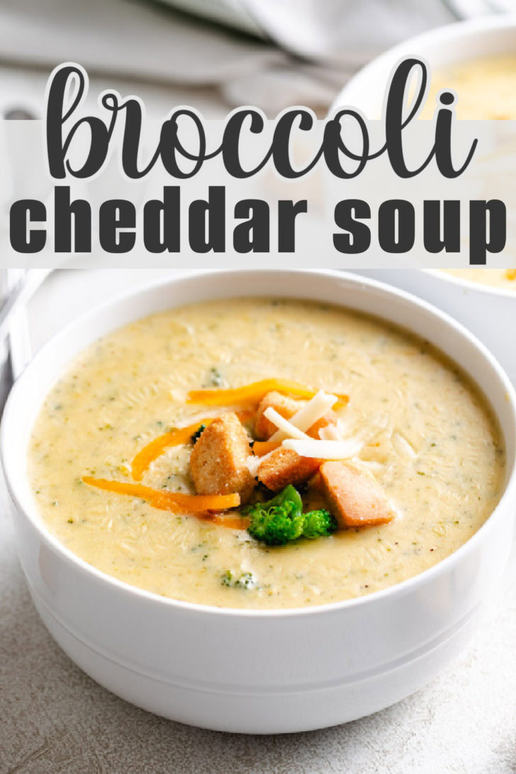 White bowl filled with cheddar and broccoli soup.