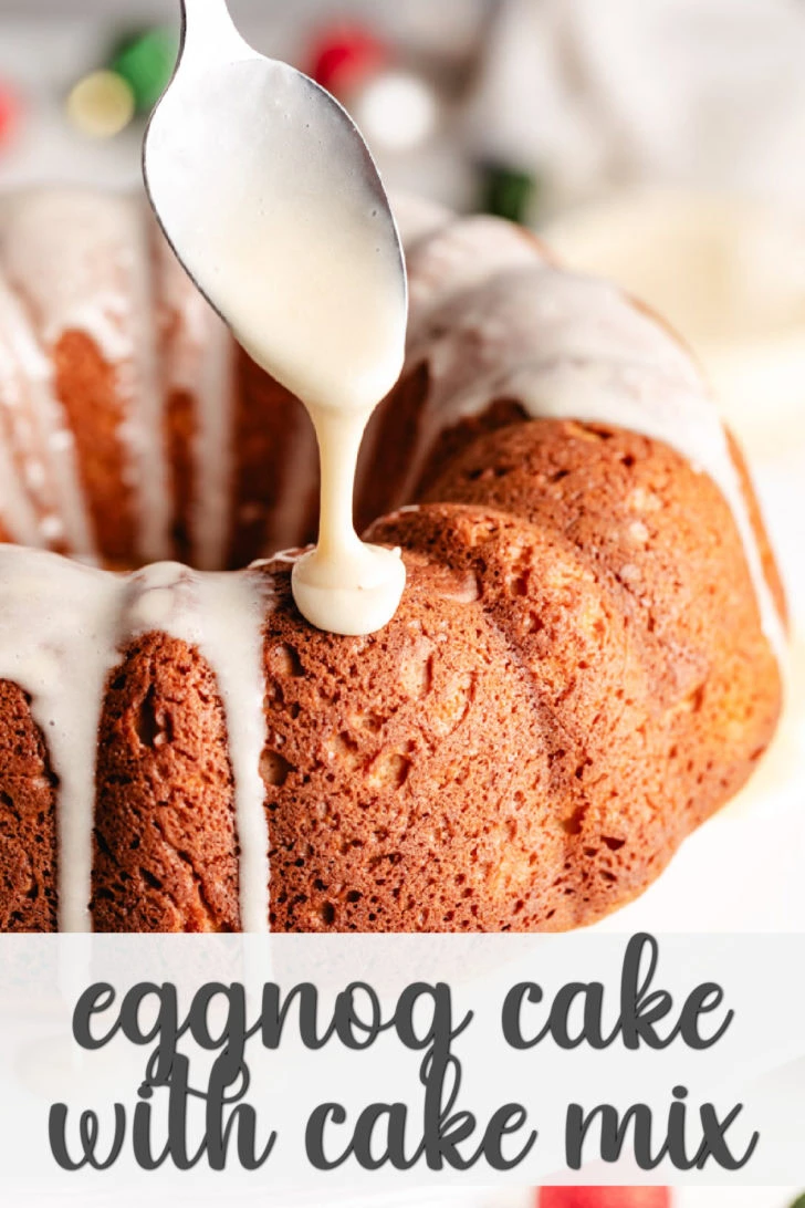 Close up view of a spoon adding glaze to a cake.