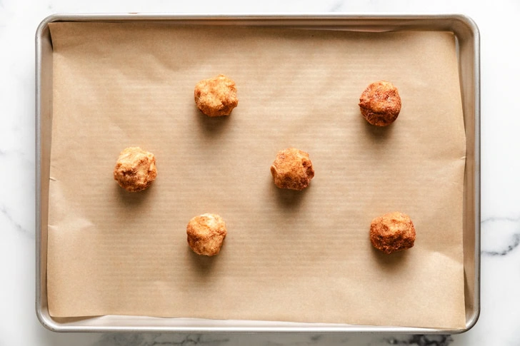 Unbaked cookie dough on a baking sheet.