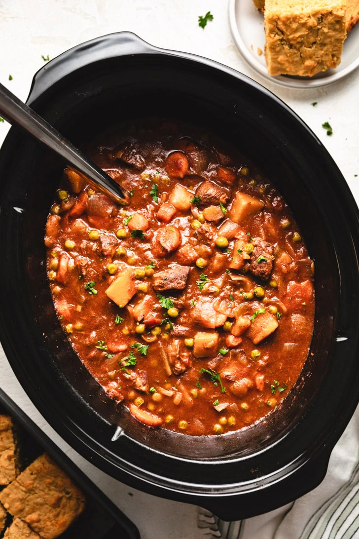 Crockpot filled with warm beef stew.