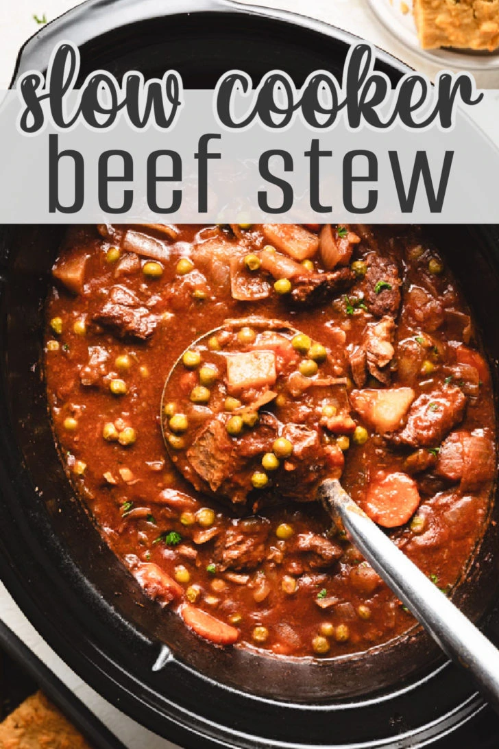 Overhead view of a ladle holding up beef stew.