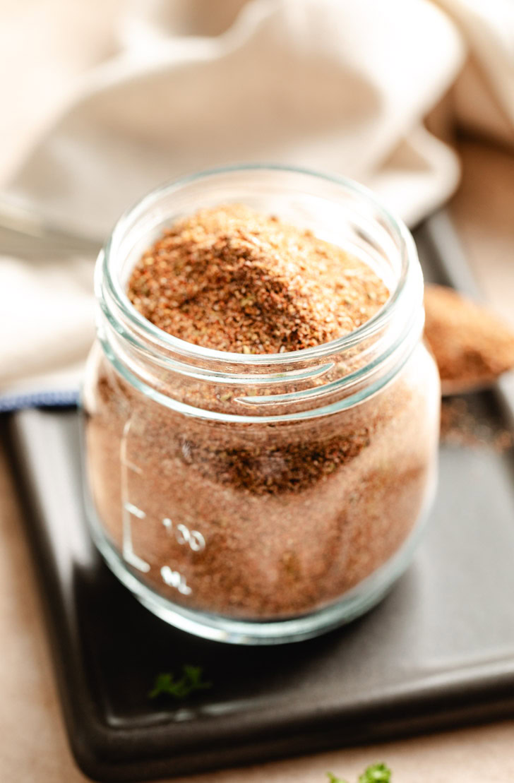 A jar of homemade spice mix for chili.