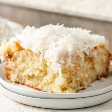 A slice of fluffy white coconut cake.