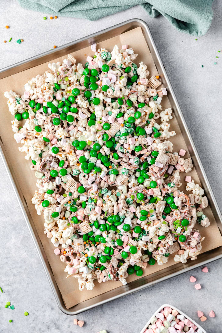 Overhead view of st. Patrick's day snack mix on a sheet pan.