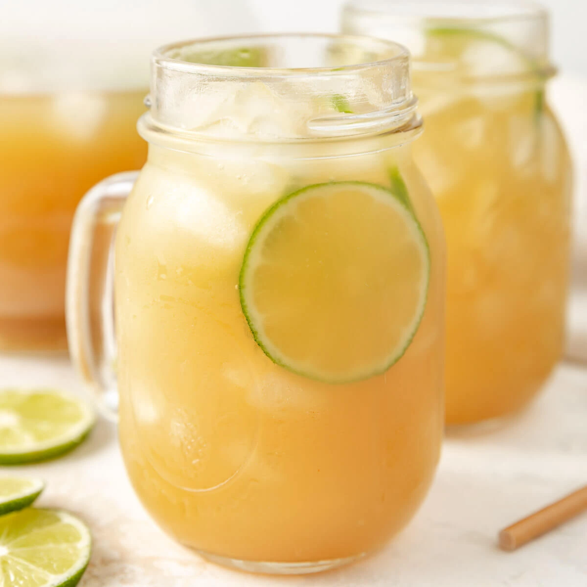 Close up view of pineapple coconut rum punch in a mason jar.